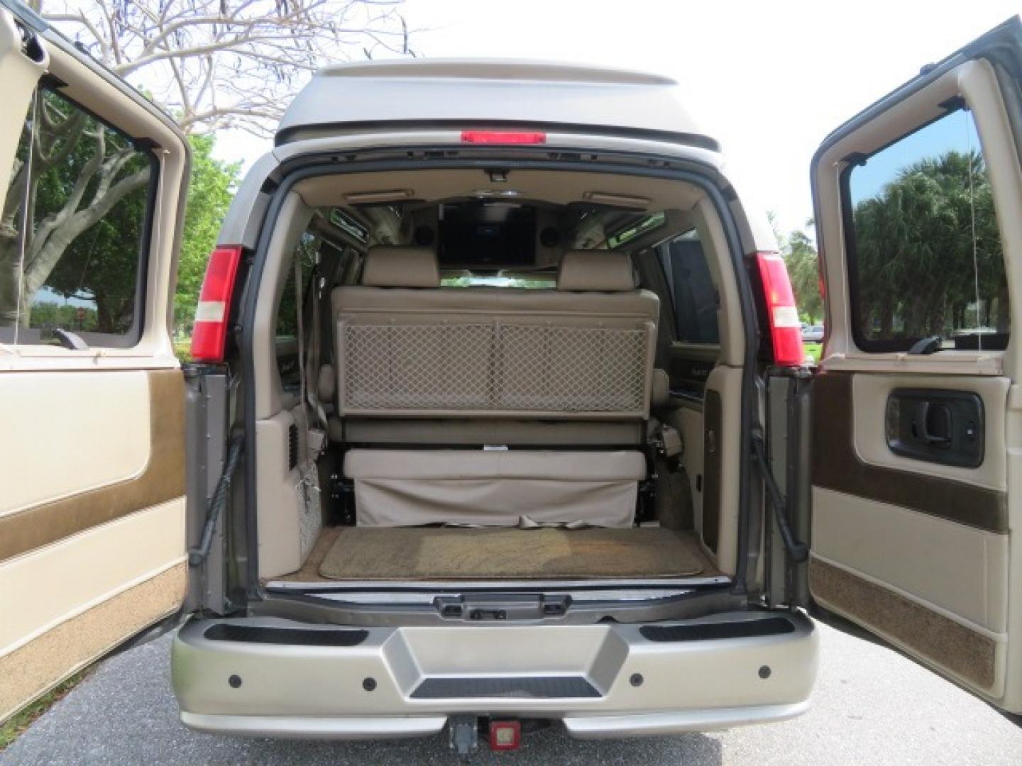 2013 /Beige Two Tone GMC Savana RV G1500 3LT (1GDS7DC45D1) with an 5.3L V8 OHV 16V engine, 4-Speed Automatic transmission, located at 4301 Oak Circle #19, Boca Raton, FL, 33431, (954) 561-2499, 26.388861, -80.084038 - You are looking at a Gorgeous 2013 GMC Savana 1500 High Top Conversion Van Explorer Limited SE Package Handicap Wheelchair Conversion Van with 72K Original Miles, Side Entry Braun Millennium Series Wheelchair Lift, Rubber Floor, Q-Straint Tie Down System, Navigation, Back Up Camera, Huge flat Screen - Photo#64